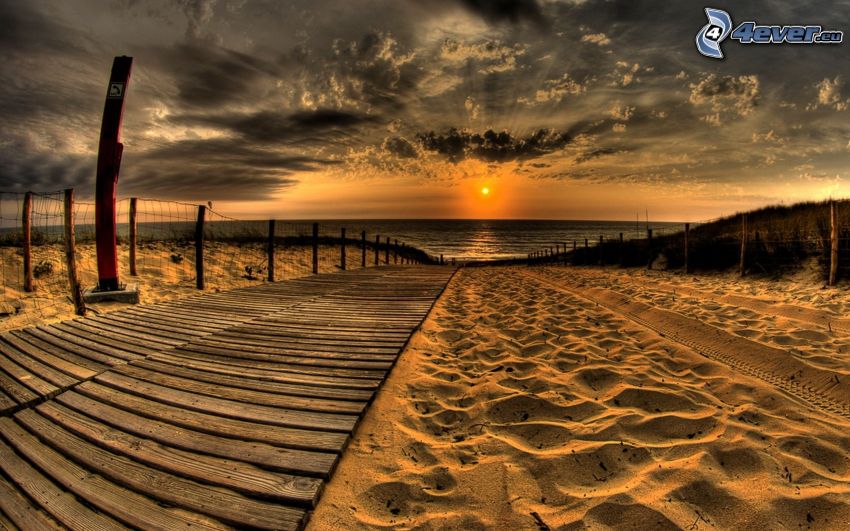 sunset over the sea, sandy beach, pier