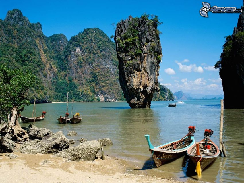 Thailand, a boat near the shore, rocky island, sea