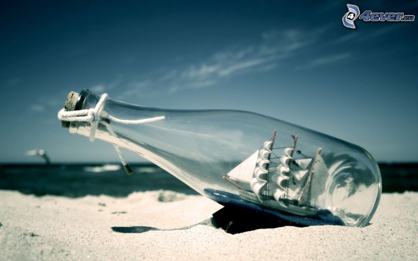 sailing ship in a bottle, sand