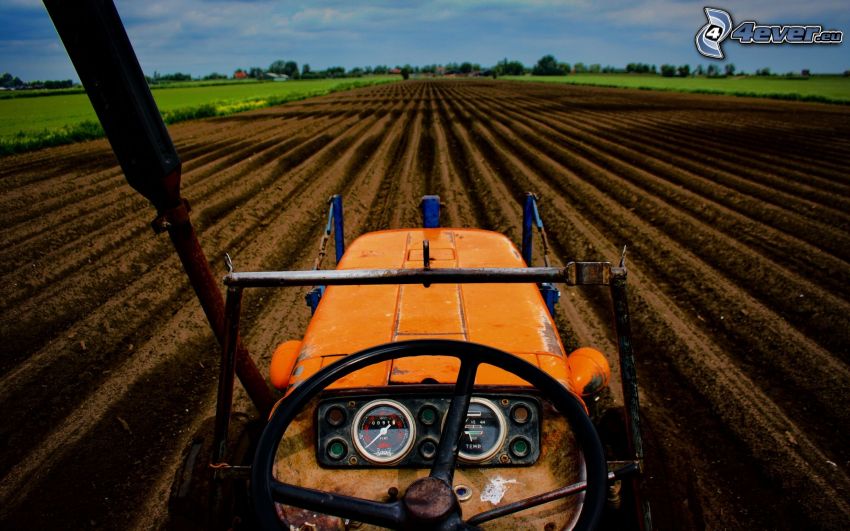 tractor on field, plowing