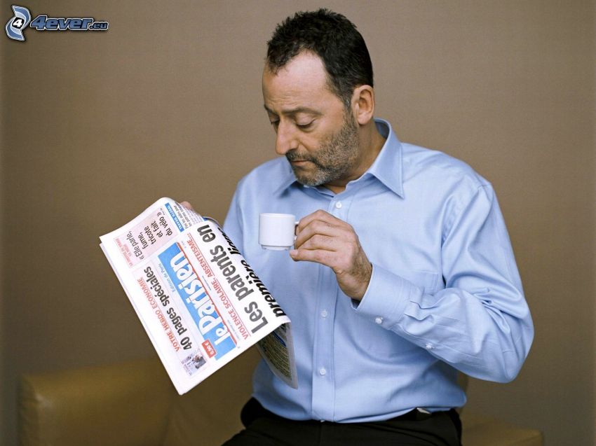 Jean Reno, newspapers, cup of coffee