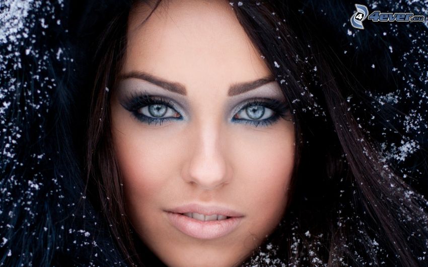beautiful woman's face, black-hair, snowflakes