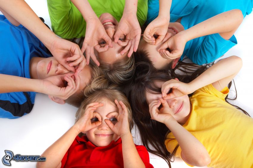 children, hands, colored shirts