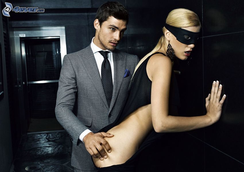 man and woman, man in suit, blonde, mask