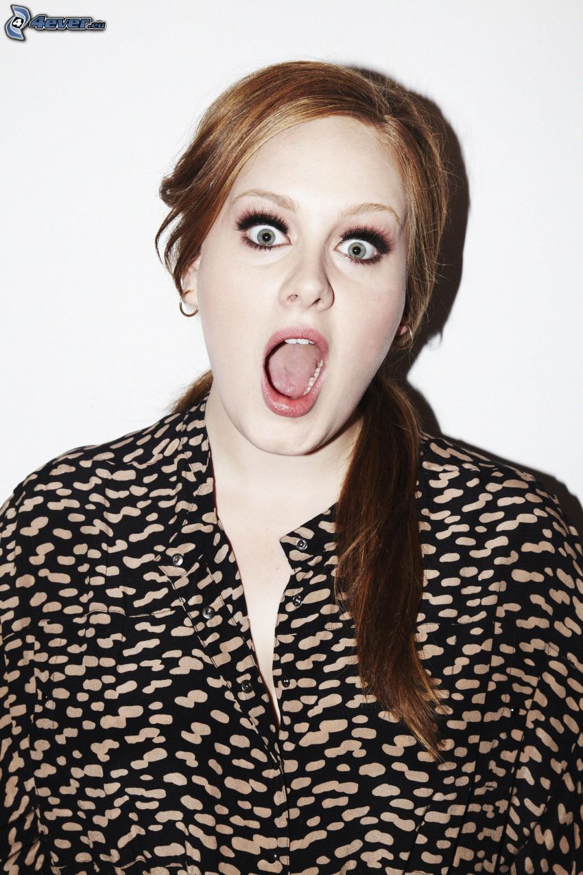 Adele, grimacing
