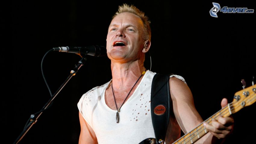 Sting, playing guitar, singing