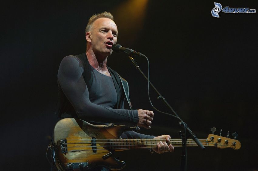 Sting, playing guitar, singing