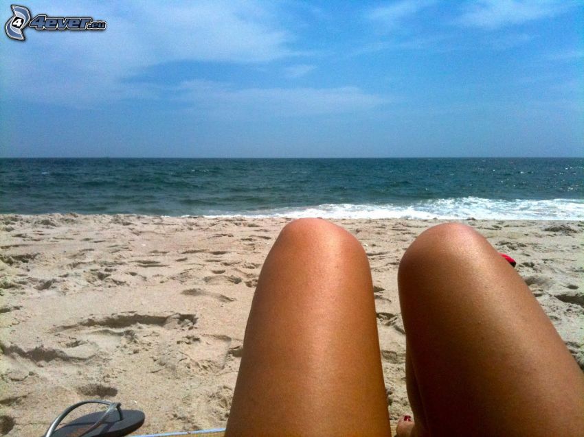 open sea, sandy beach, legs, sunbathing