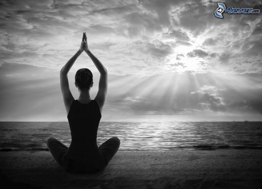 yoga, meditation, turkish sit, open sea, sun behind the clouds, sunbeams