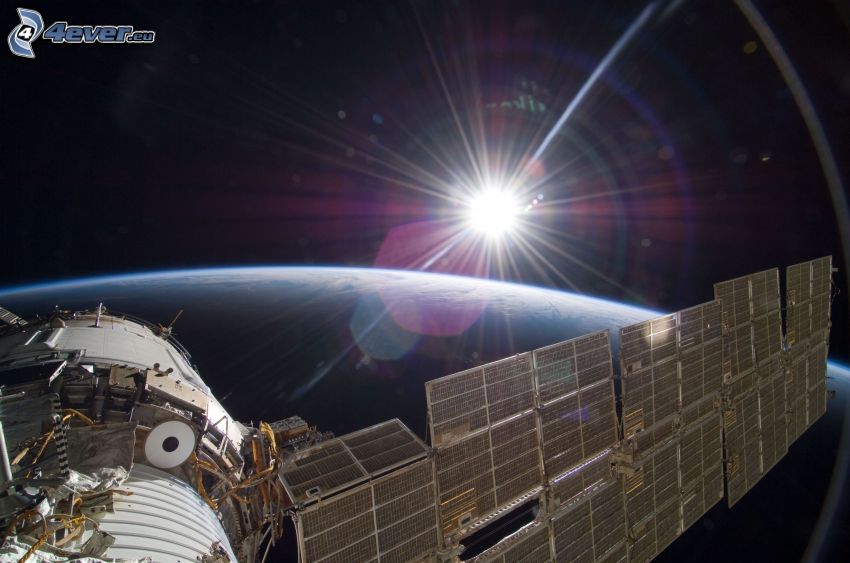 ISS over Earth, sun