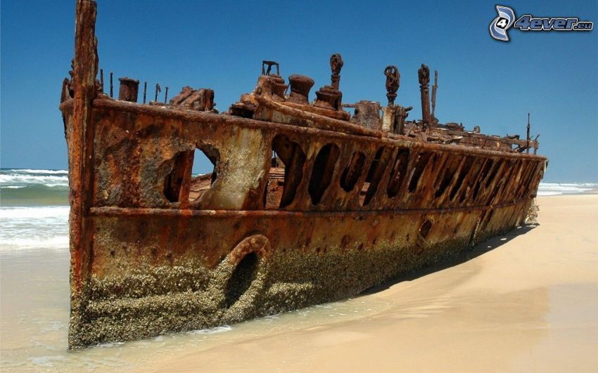 abandoned rusty ship, beach