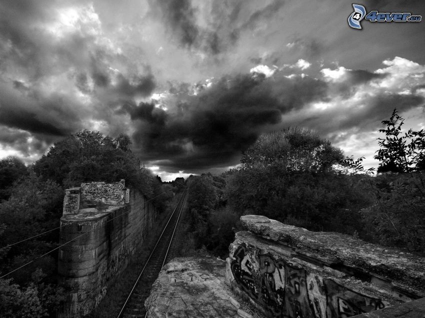 rails, rocks, forest, clouds, black and white photo