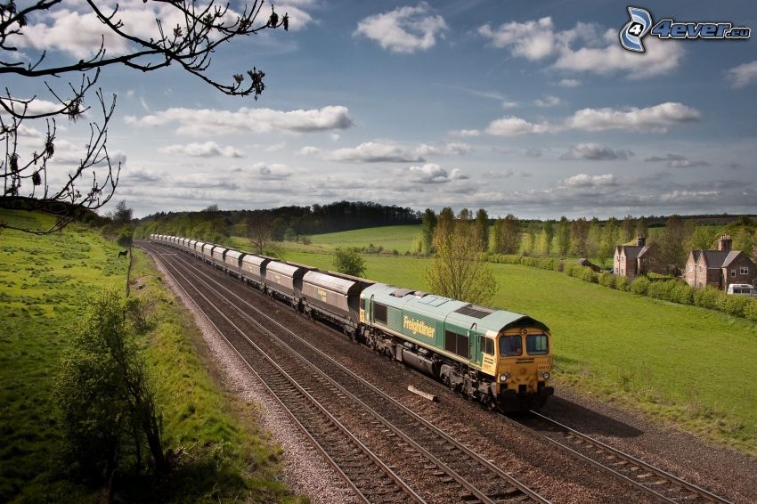 train, rails, green meadow, clouds